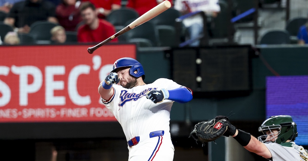 Apr 30, 2025; Arlington, Texas, USA; Texas Rangers first baseman Jake Burger (21) loses his bat during the first inning against the Oakland Athletics at Globe Life Field.