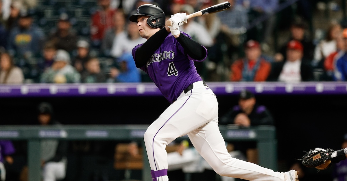 May 19, 2025; Denver, Colorado, USA; Colorado Rockies first baseman Michael Toglia (4) hits a double in the sixth inning against the Philadelphia Phillies at Coors Field.
