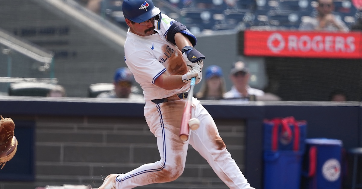Aug 16, 2025; Toronto, Ontario, CAN; Toronto Blue Jays left fielder Davis Schneider (36) hits a single against the Texas Rangers during the the second inning at Rogers Centre.