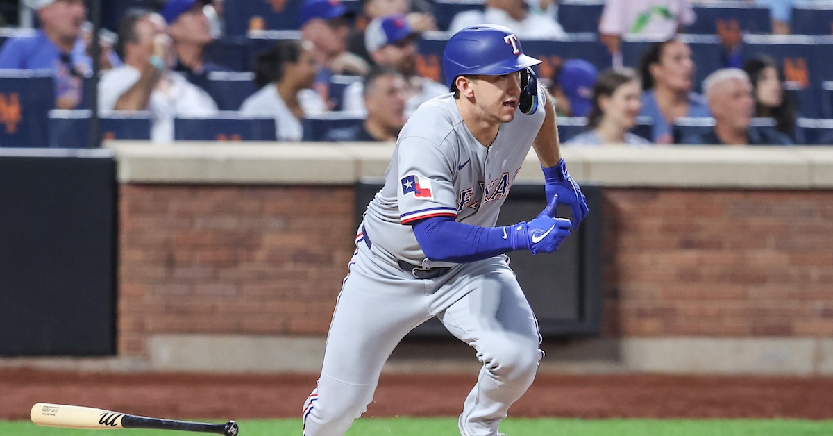 Wyatt Langford taking off from the box after putting the ball in play.