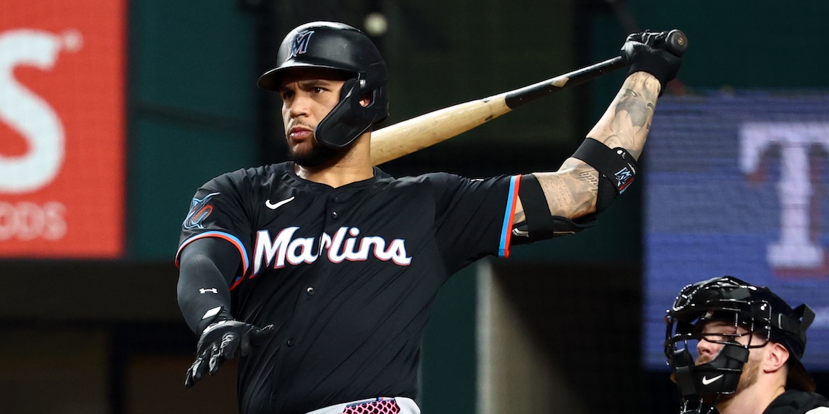 Miami Marlins designated hitter Agustin Ramirez hits a double during the third inning against the Texas Rangers at Globe Life Field.