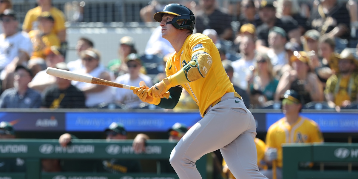 Athletics designated hitter Brent Rooker (25) hits a single against the Pittsburgh Pirates during the first inning at PNC Park.