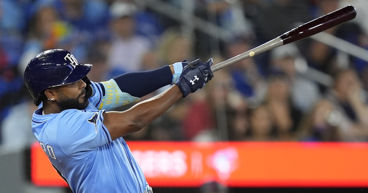 Tampa Bay Rays third baseman Junior Caminero (13) hits a single against the Toronto Blue Jays during the eighth inning at Rogers Centre. 