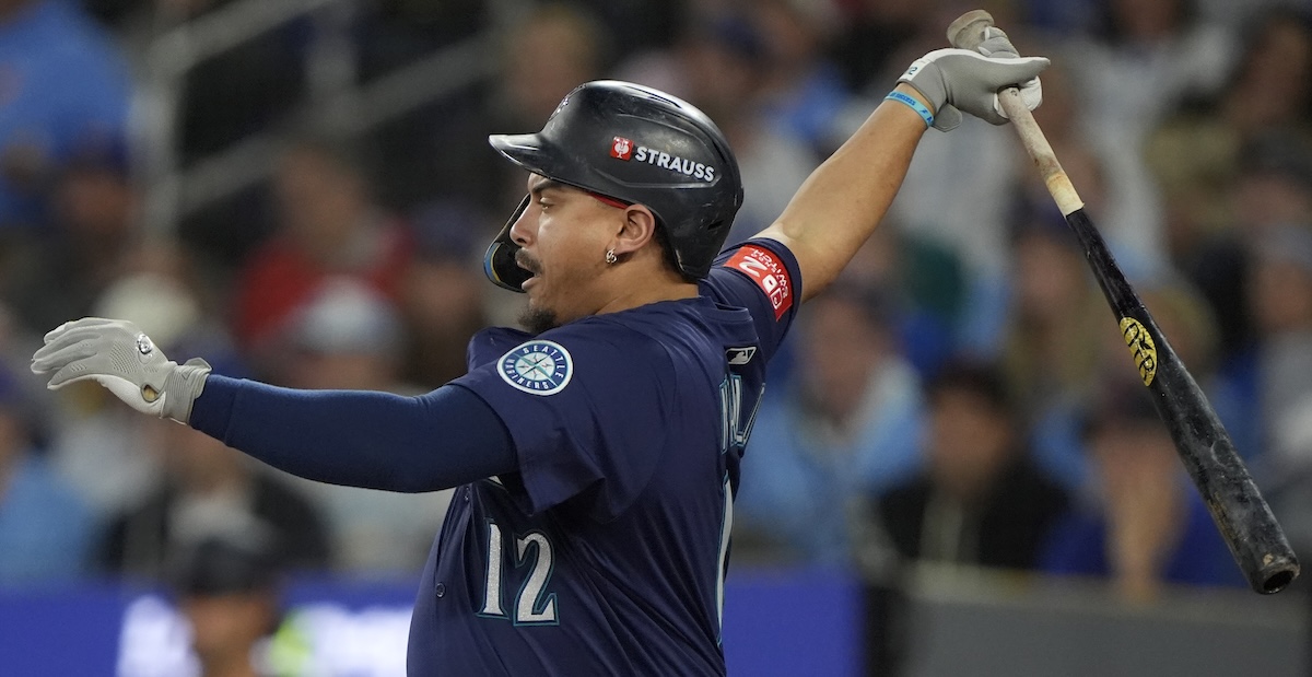 Seattle Mariners first baseman Josh Naylor (12) hits an RBI single against the Toronto Blue Jays in the first inning during game seven of the ALCS round for the 2025 MLB playoffs at Rogers Centre.