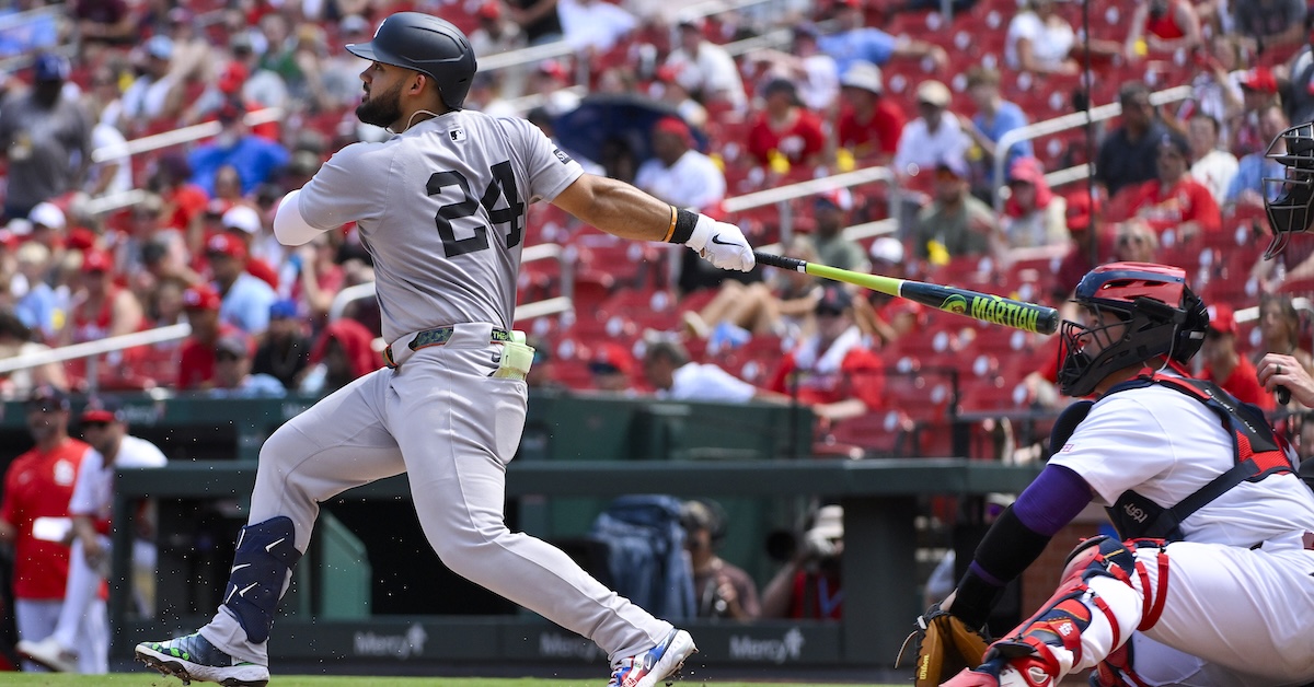 New York Yankees left fielder Jasson Dominguez (24) hits a one run single against the St. Louis Cardinals during the fourth inning at Busch Stadium.