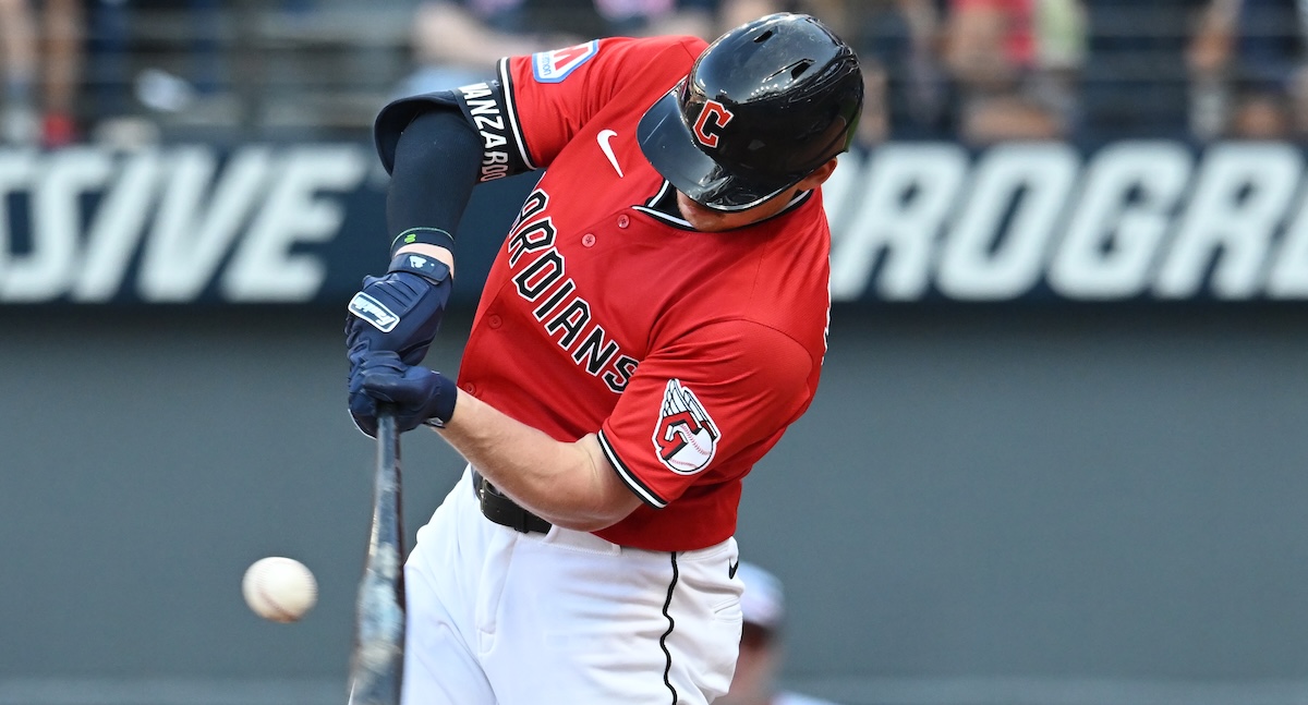 Cleveland Guardians first baseman Kyle Manzardo (9) hits a double against the Texas Rangers during the eighth inning at Progressive Field. 